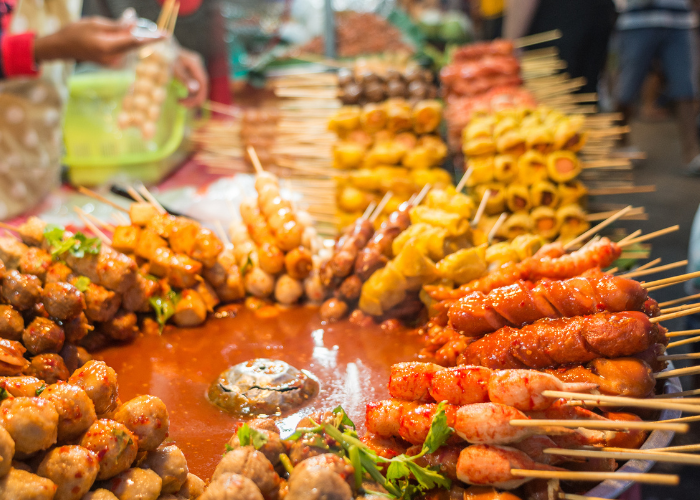 Thai street-food skewers at a market